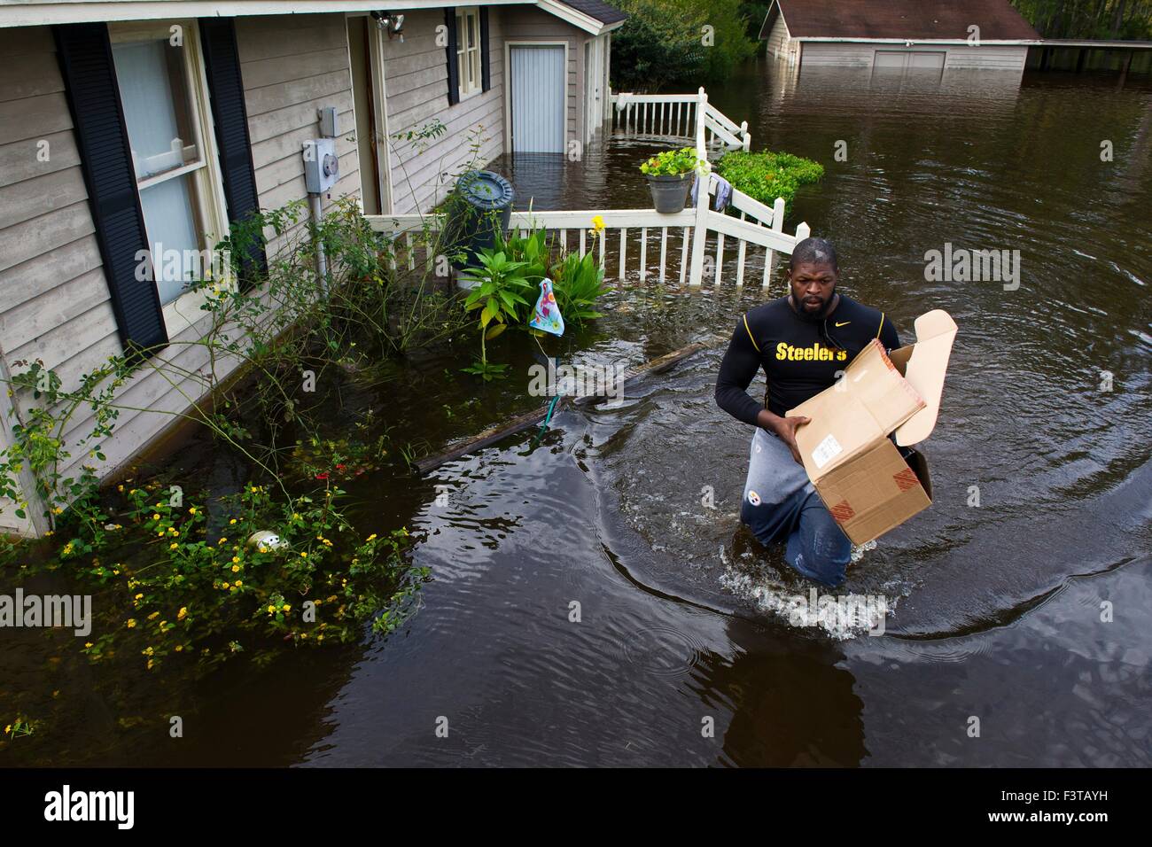 Pittsburgh Steelers football player Clifton Geathers helps remove