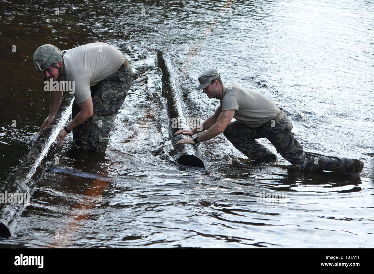 National guardsmen assist in removing debris from flooded roads October 9, 2015 in Adams Run