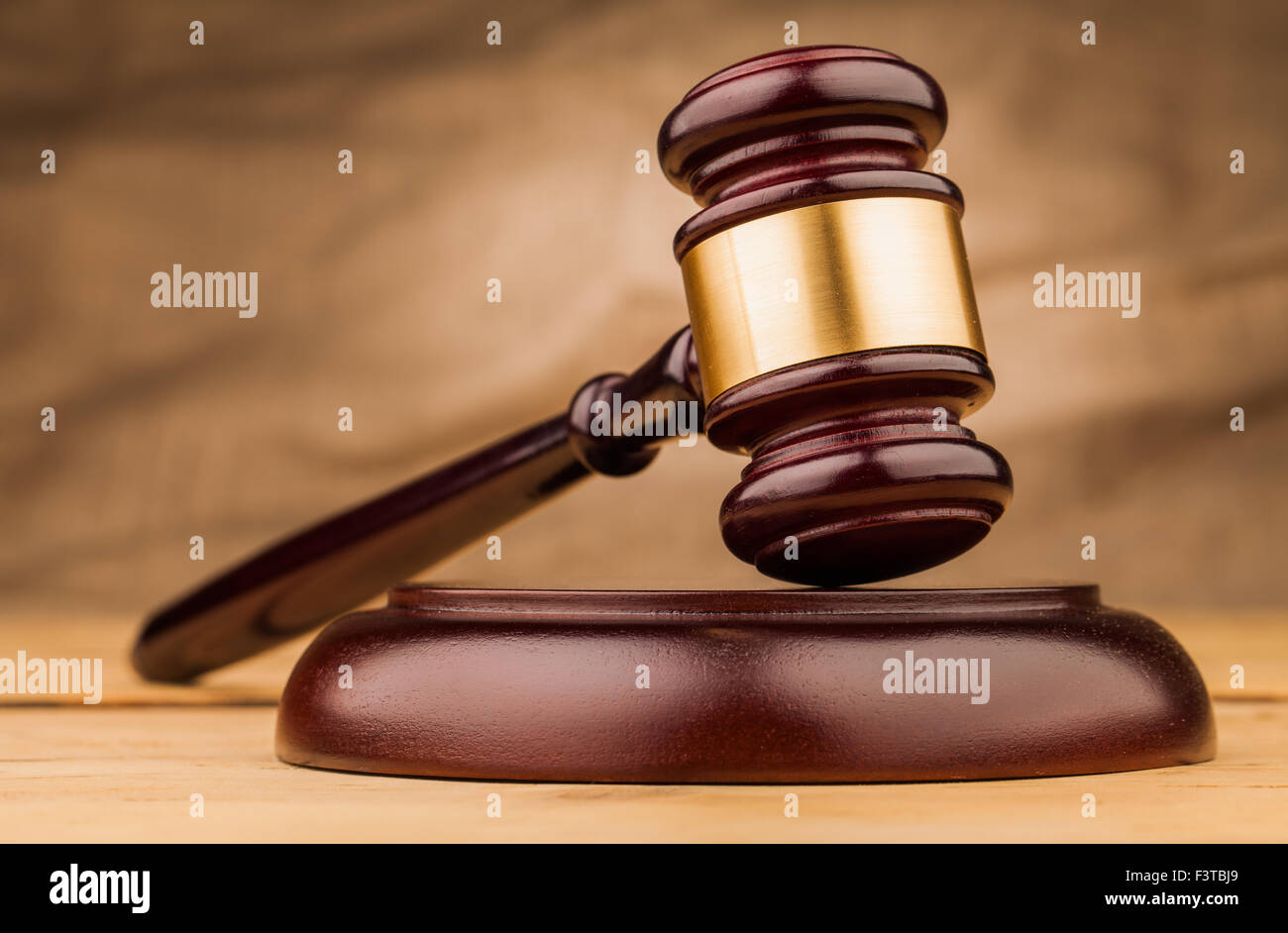brown judge gavel on wooden  table closeup Stock Photo