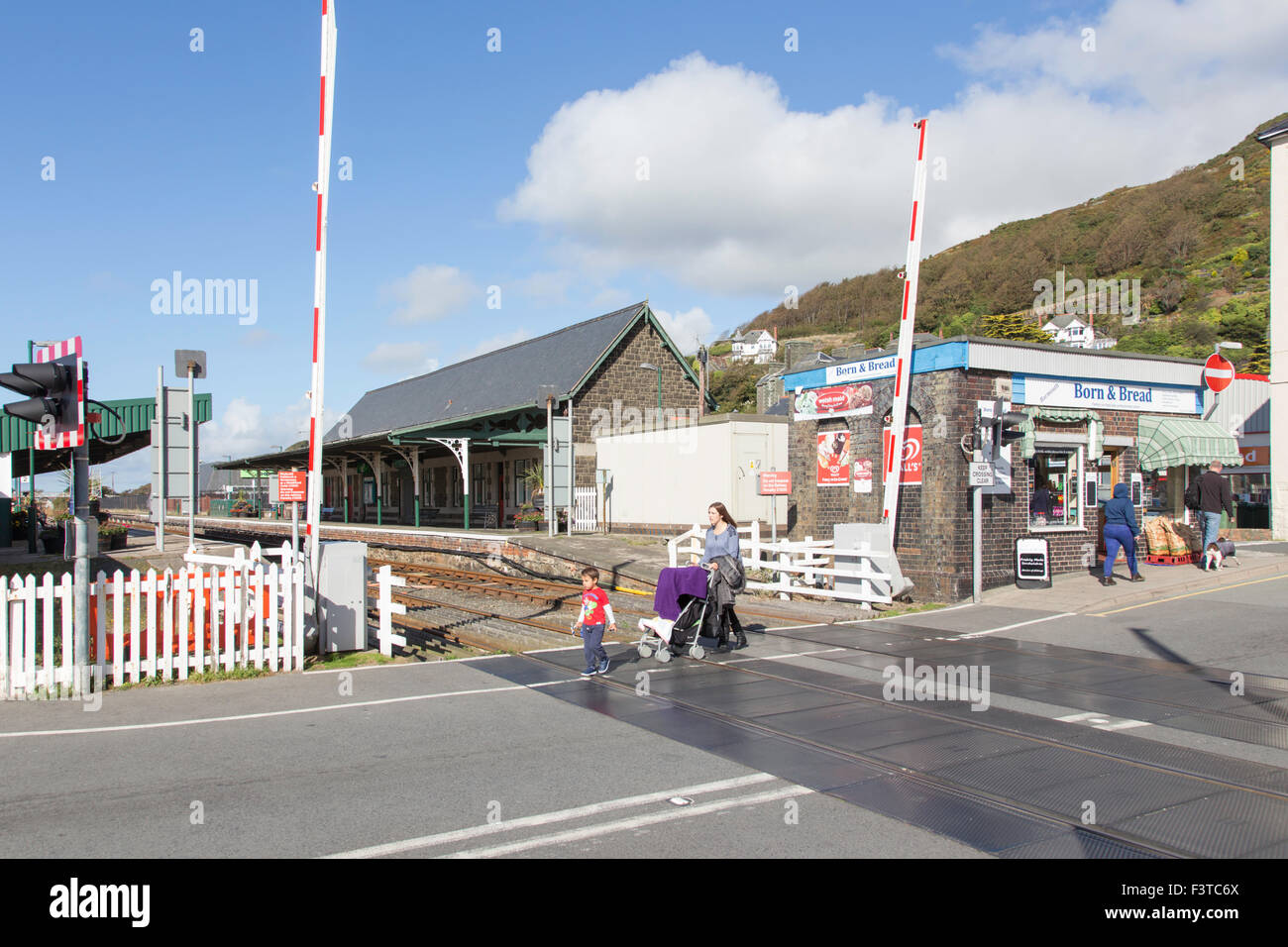 Rail crossing in the seaside town of Barmouth, North Wales, UK Stock Photo
