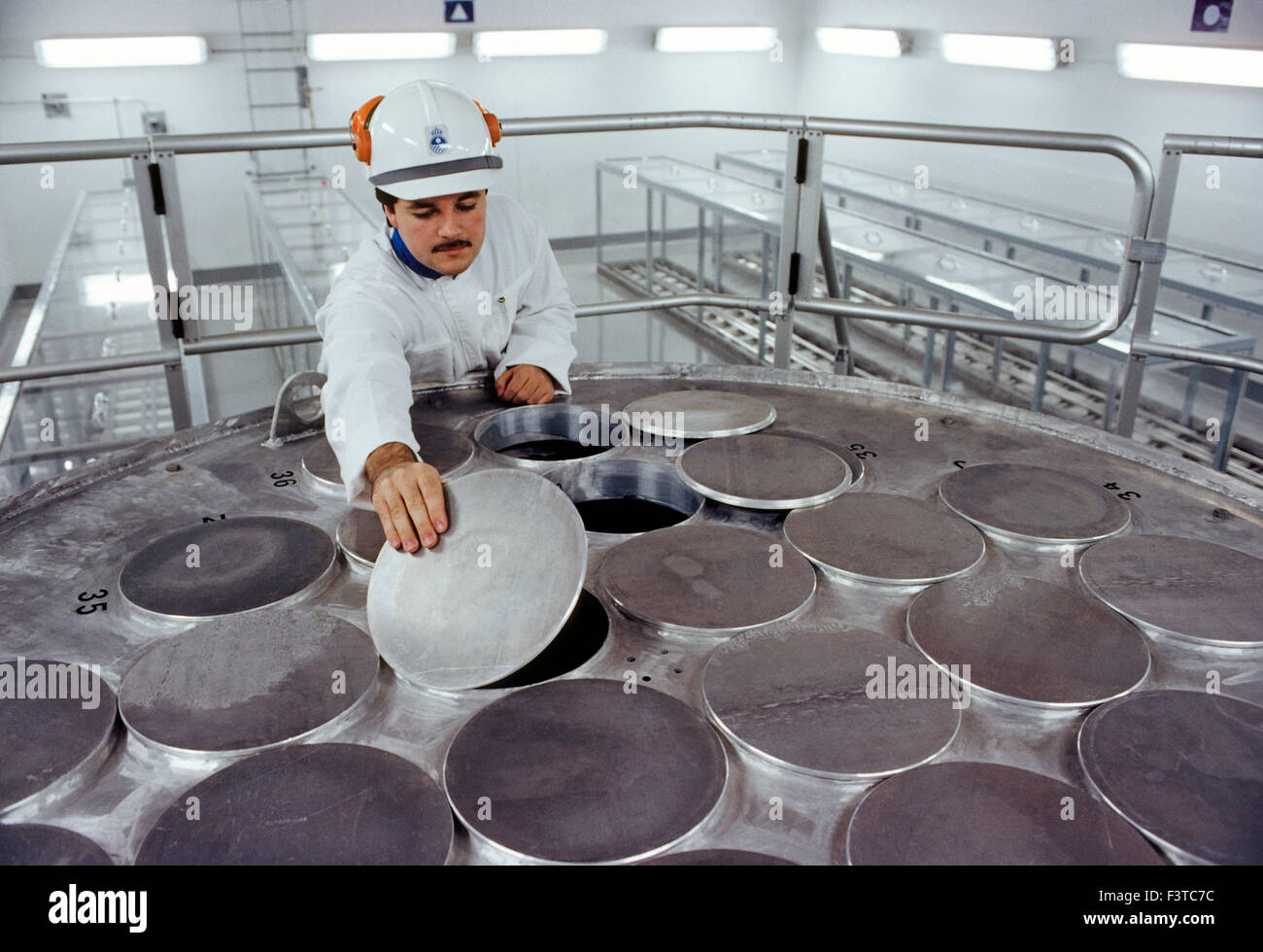 Technicians inside nuclear power plant near Stockholm, Sweden Stock Photo