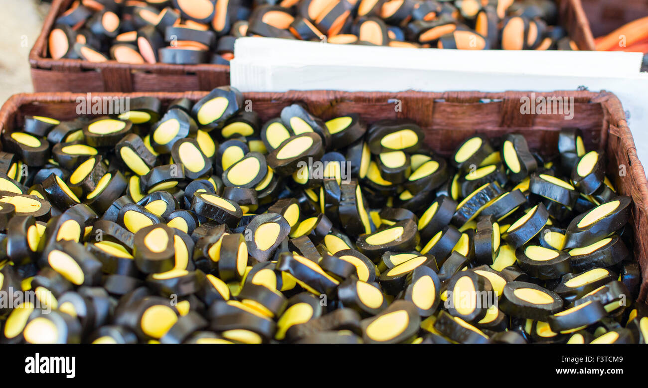 candy licorice and fruit on display at a street market Stock Photo Alamy