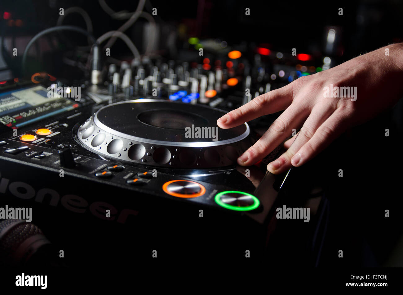 Close up of DJ spinning Stock Photo