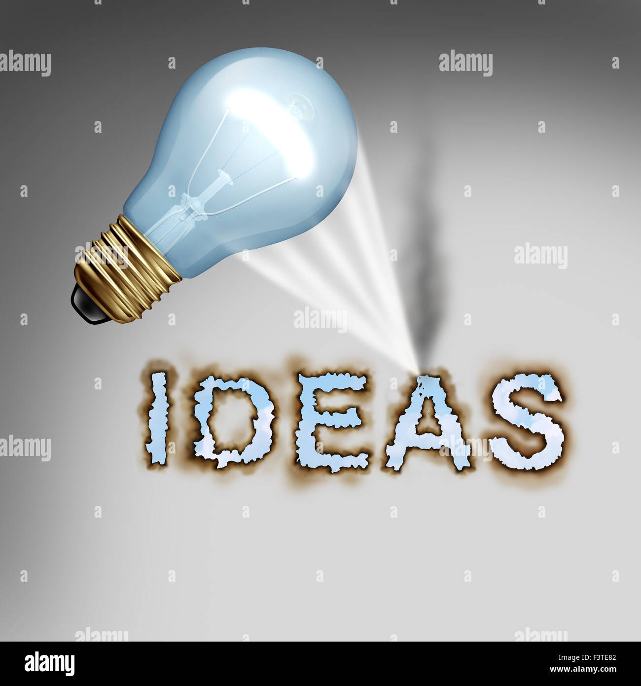 Idea concept creative symbol with a lightbulb reflecting a hot concentrated beam of light on paper burning letters as a design metaphor for the energy of creativity and powerful thinking. Stock Photo