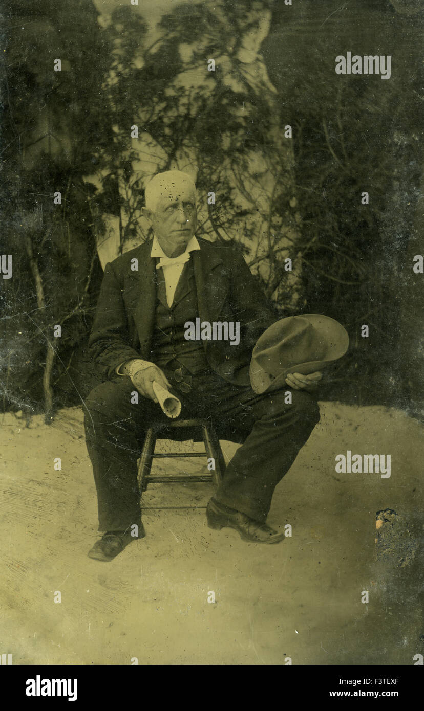 Tintype photo of man sitting, late 1800s Tintype photo of man sitting, late 1800s