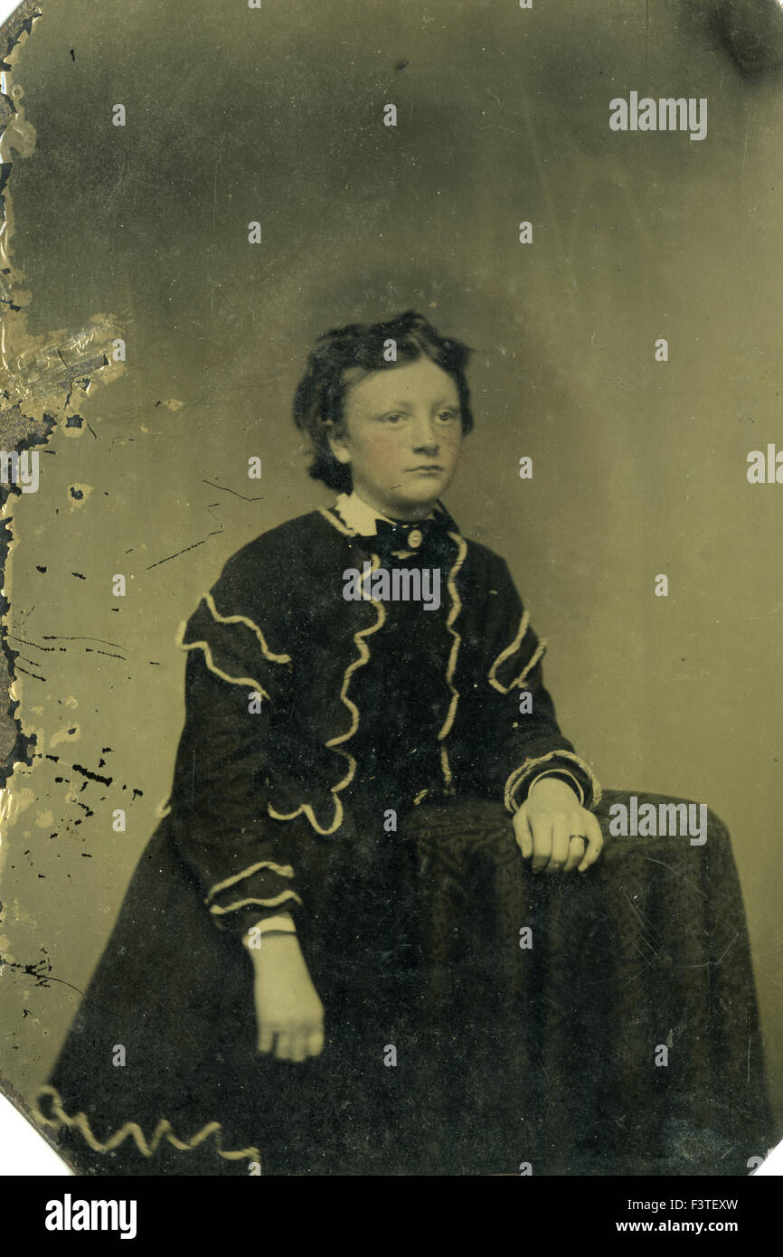 Tintype photo of young girl sitting in chair, late 1800s Tintype photo of young girl sitting in chair, late 1800s