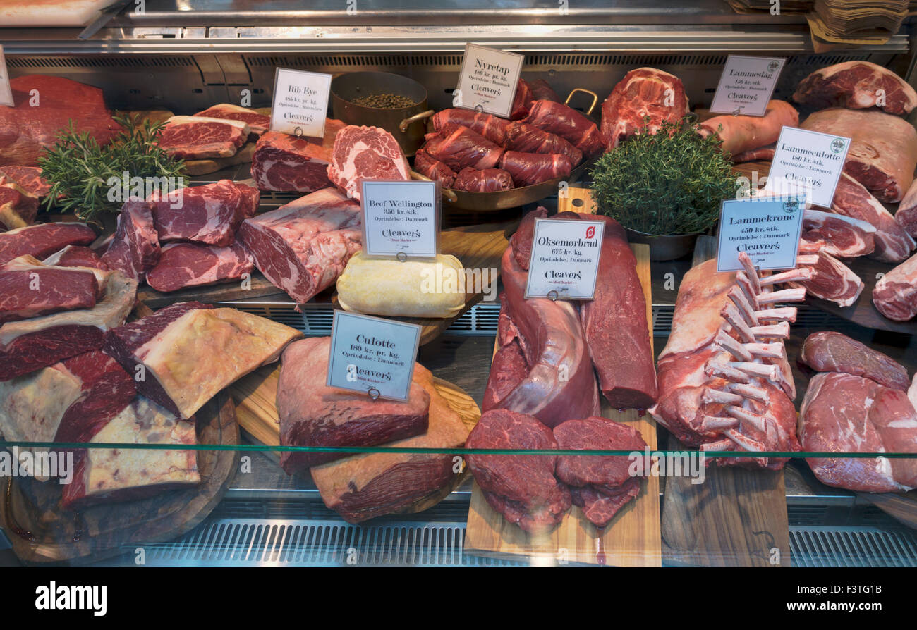 Meat in the cold counter at Cleaver's Meat Market at Torvehallerne, the covered food market at Israels Plads in Copenhagen Stock Photo