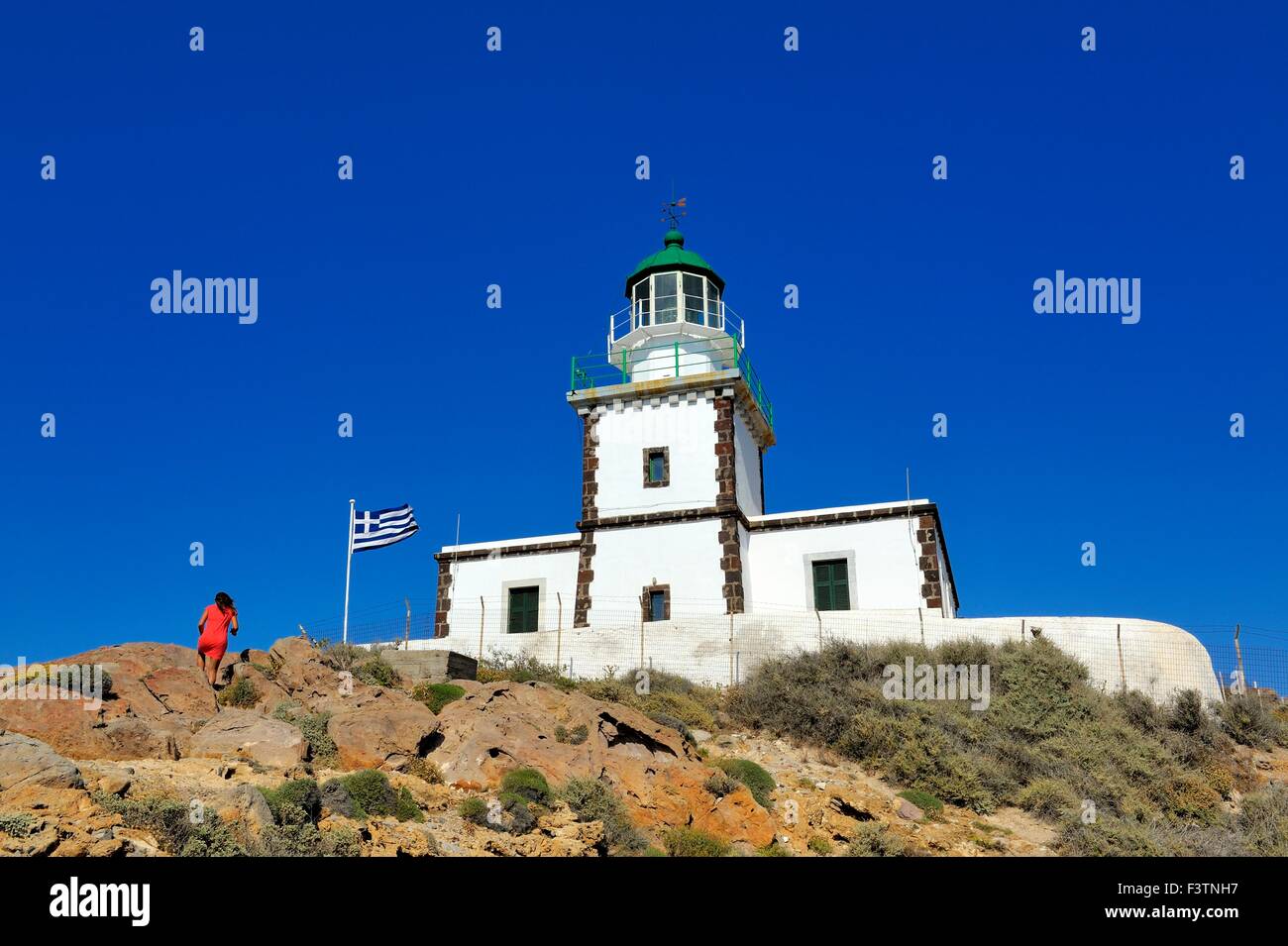 A lighthouse on the cliff at cape Akrotiri Santorini Greece Stock Photo