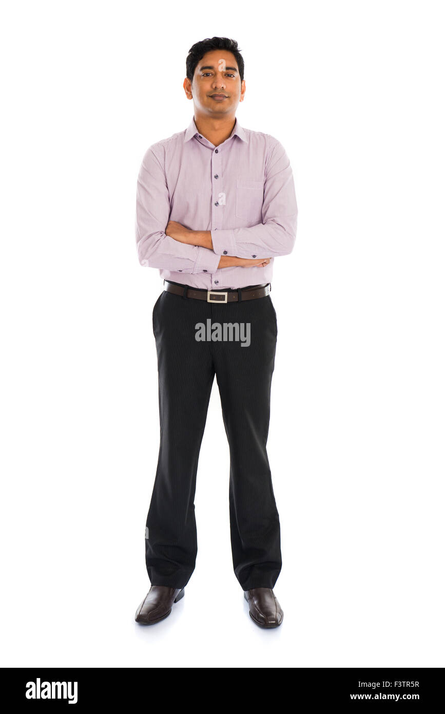 Full length portrait of smiling businessman standing arms crossed over ...