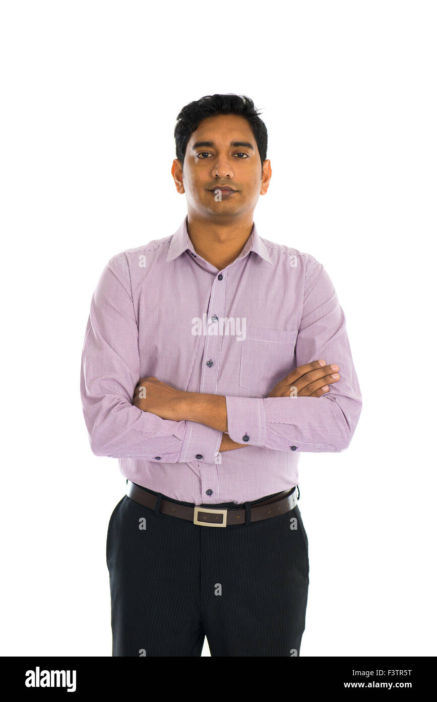 Full length portrait of smiling businessman standing arms crossed over ...