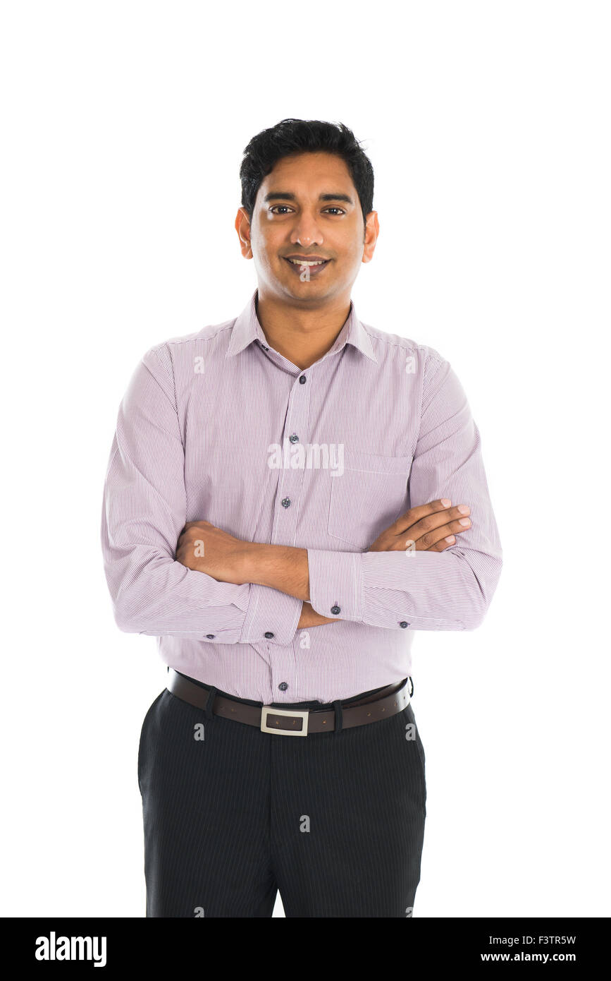 Full length portrait of smiling businessman standing arms crossed over ...