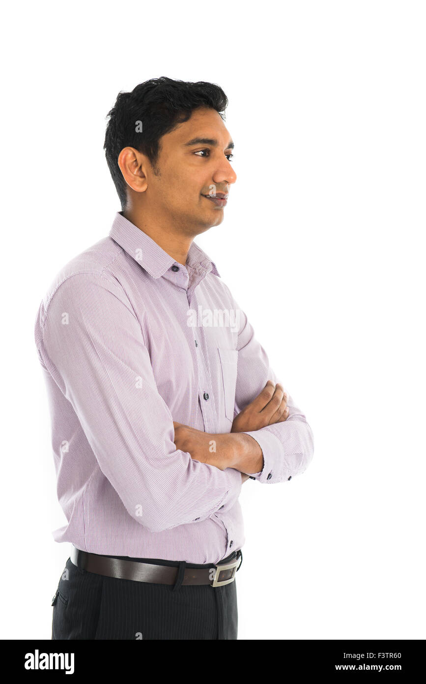Full length portrait of smiling businessman standing arms crossed over ...