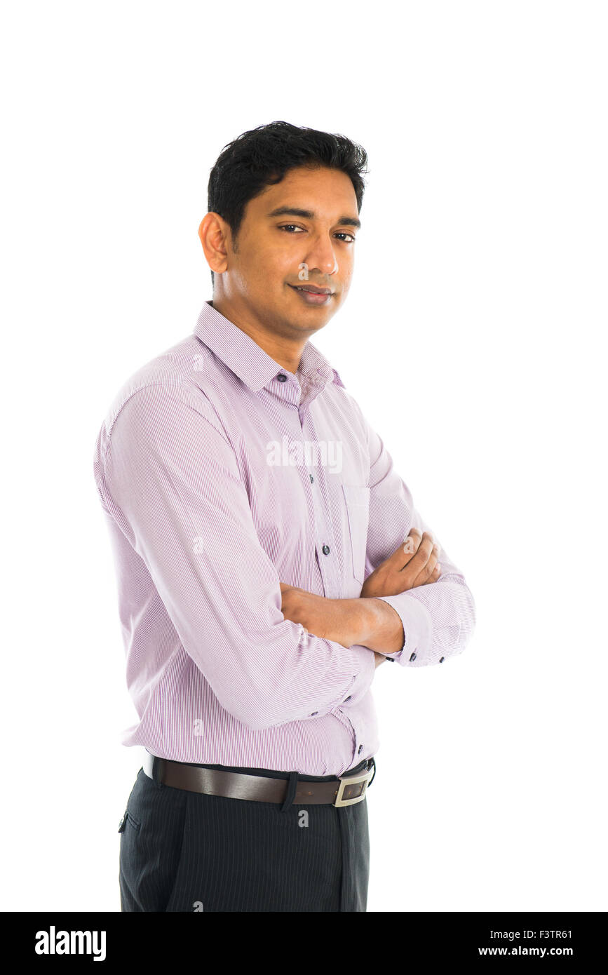 Full length portrait of smiling businessman standing arms crossed over ...