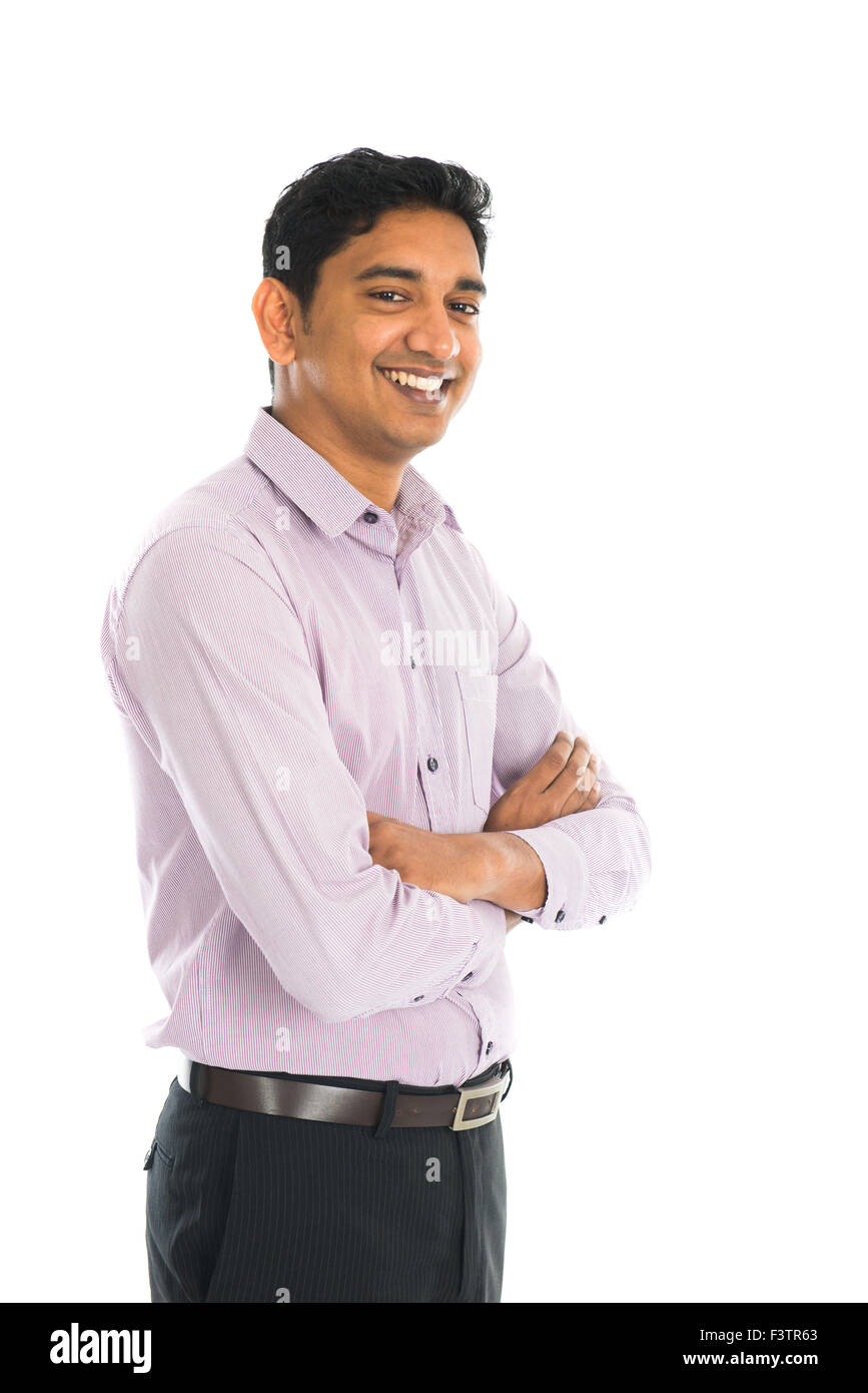 Full length portrait of smiling businessman standing arms crossed over ...