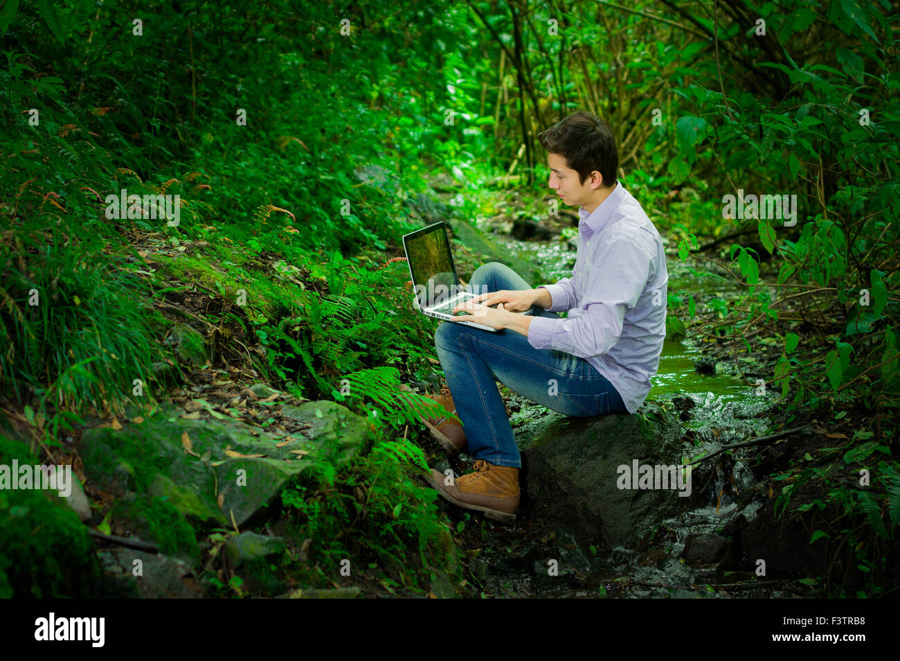 Honeguy Using Internet Young handsome man using laptop with great internet connectivity in the ...