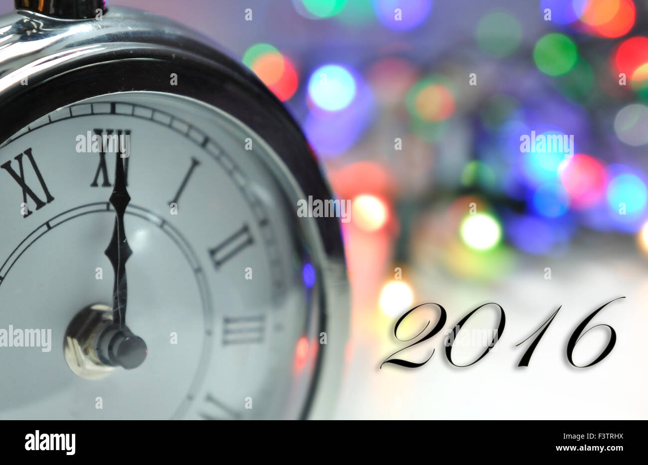 2016 - midnight O clock with bokeh background Stock Photo