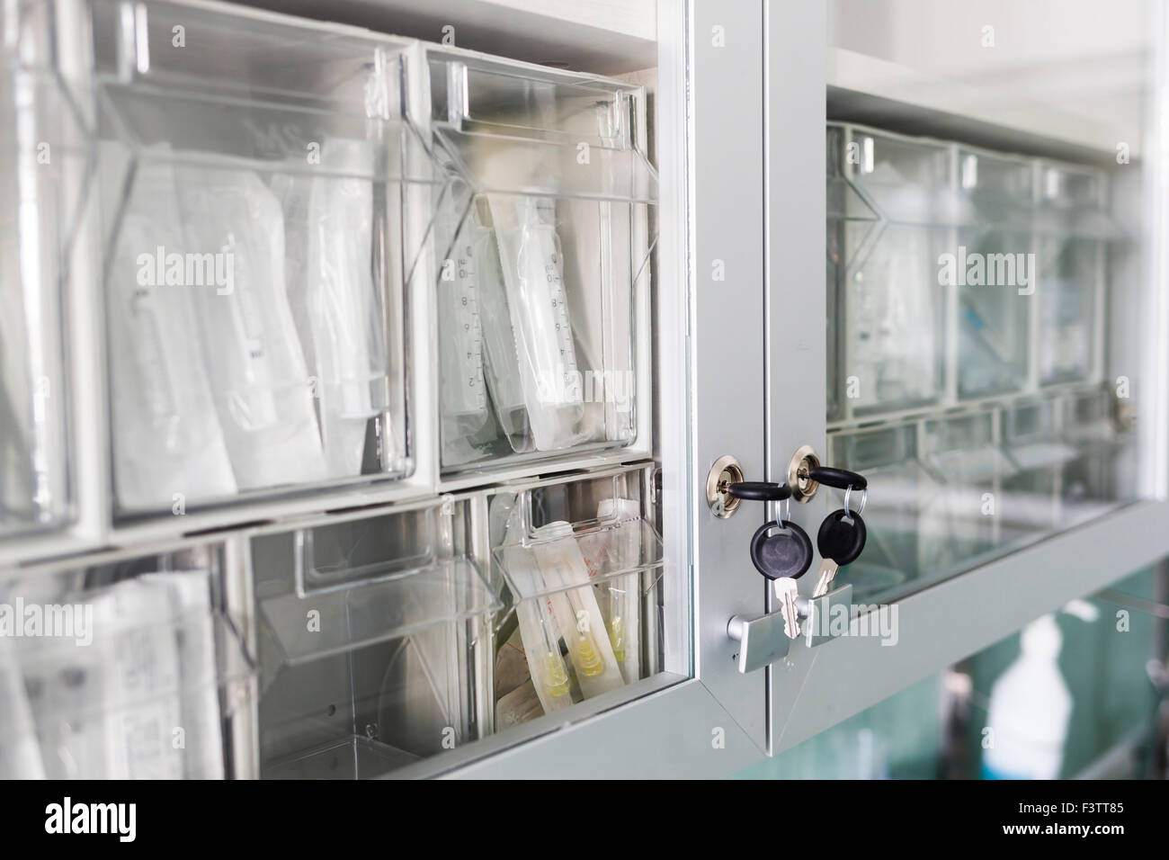 Locked syringes in a shelf in a hospital Stock Photo Alamy