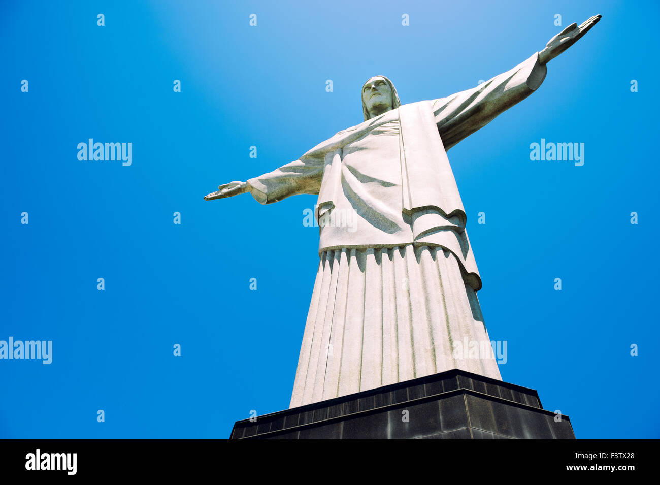 RIO DE JANEIRO, BRAZIL - OCTOBER 20, 2013: Statue of Christ the Redeemer stands on its base at the top of Corcovado Mountain. Stock Photo