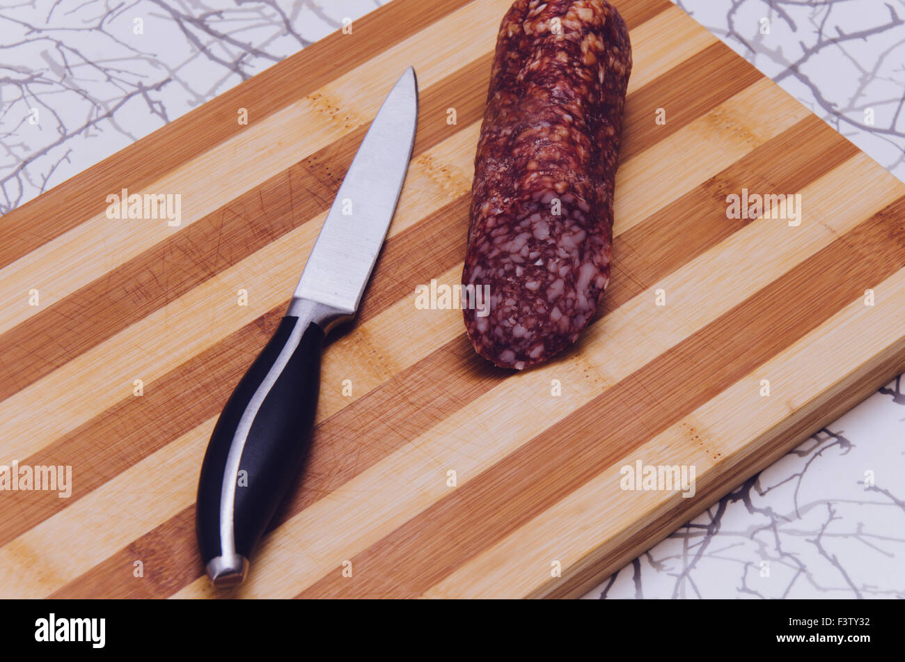 Knife And Sausage Stock Photo