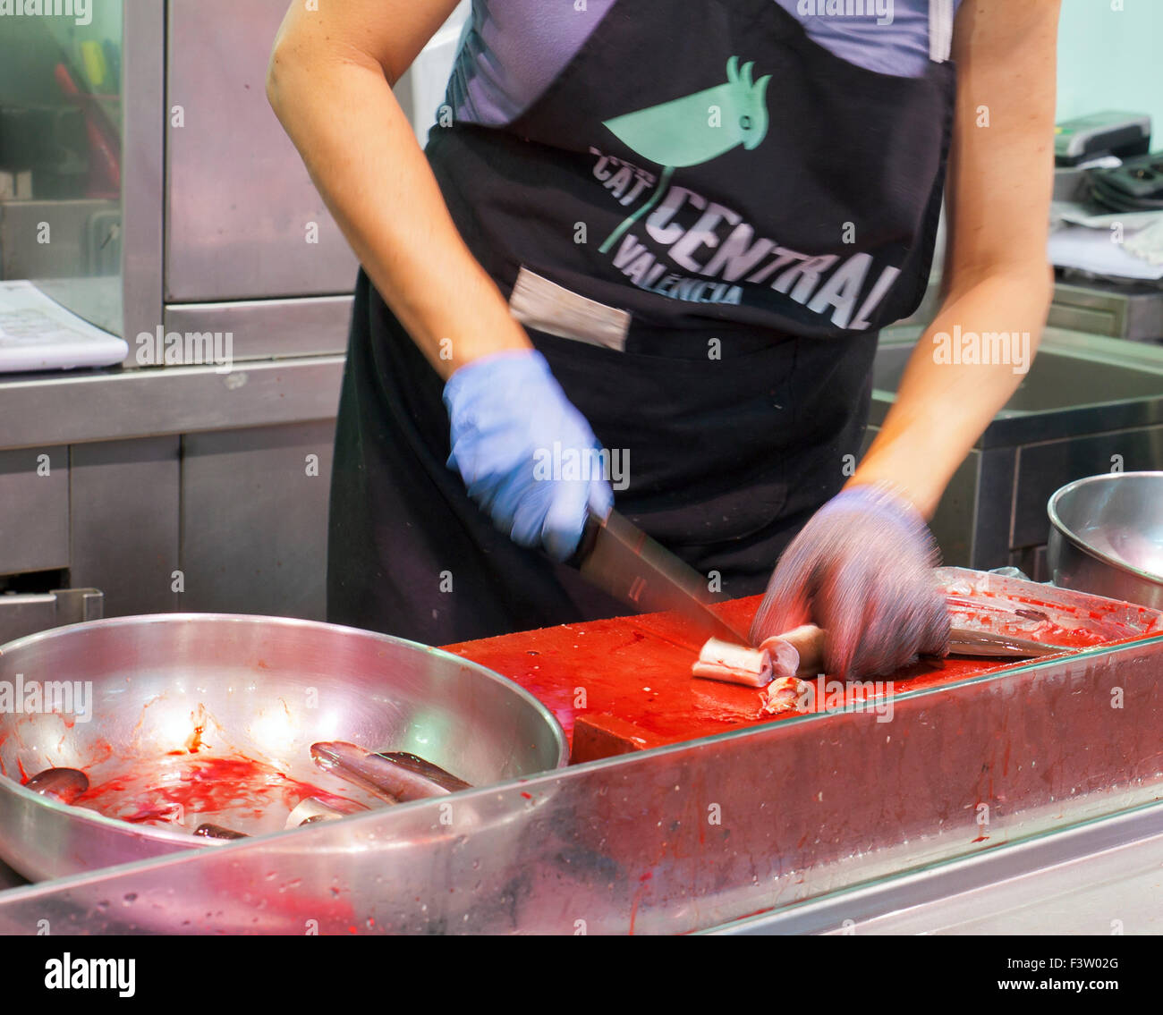 Fishmonger chopping live eels, Spanish market, Mercado Central Valencia. Stock Photo