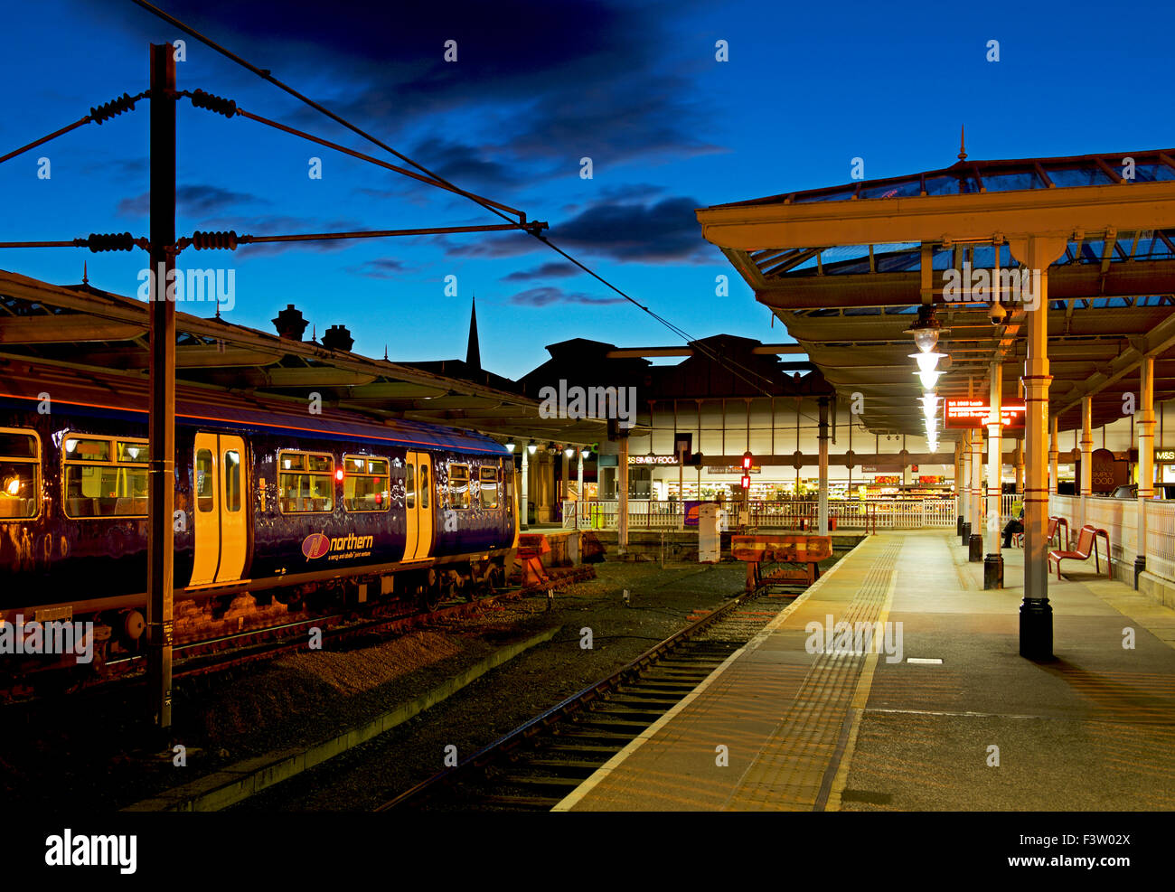 Railway station at night, Ilkley, West Yorkshire, England UK Stock Photo