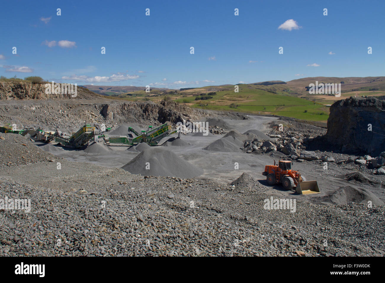 Rock crushing machinery in a working roadstone quarry. Ystrad Meurig quarry. Ceredigion, Wales. April. Stock Photo