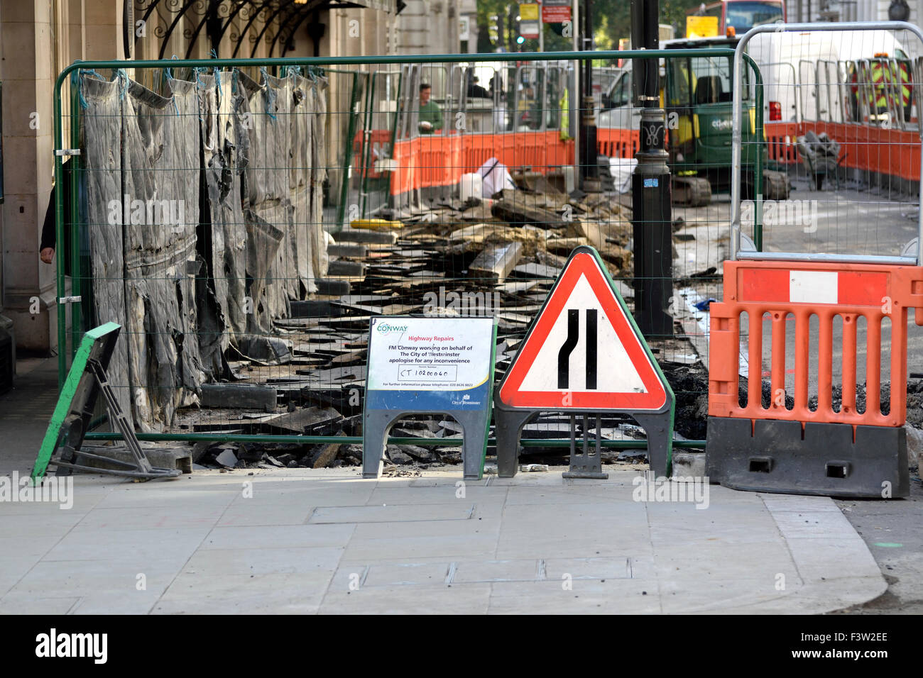London, England, UK. Roadworks in central London - disruption caused to pedestrians by repairs to the pavement Stock Photo
