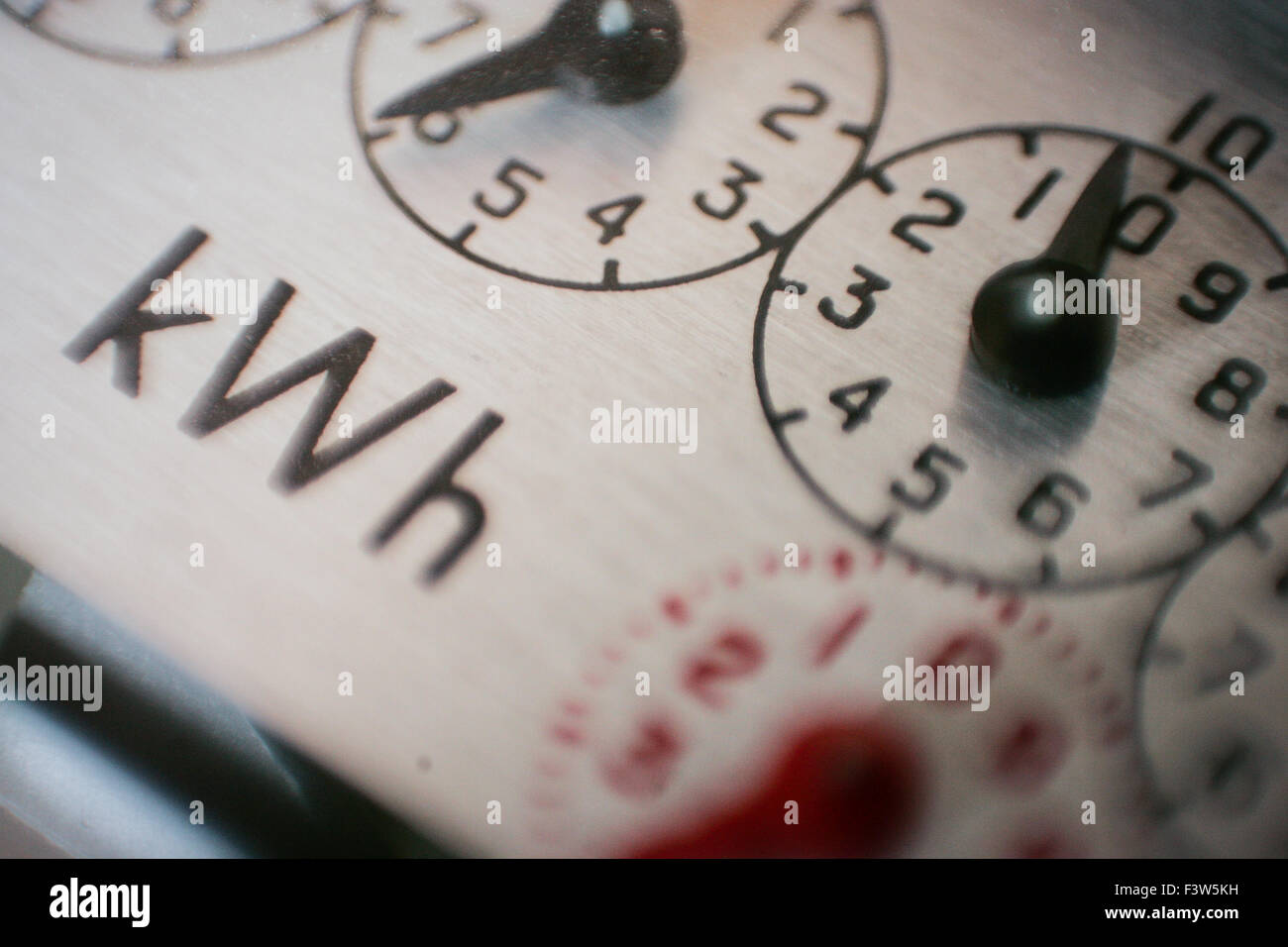 A detailed macro photograph of the clocks on an analogue electricity