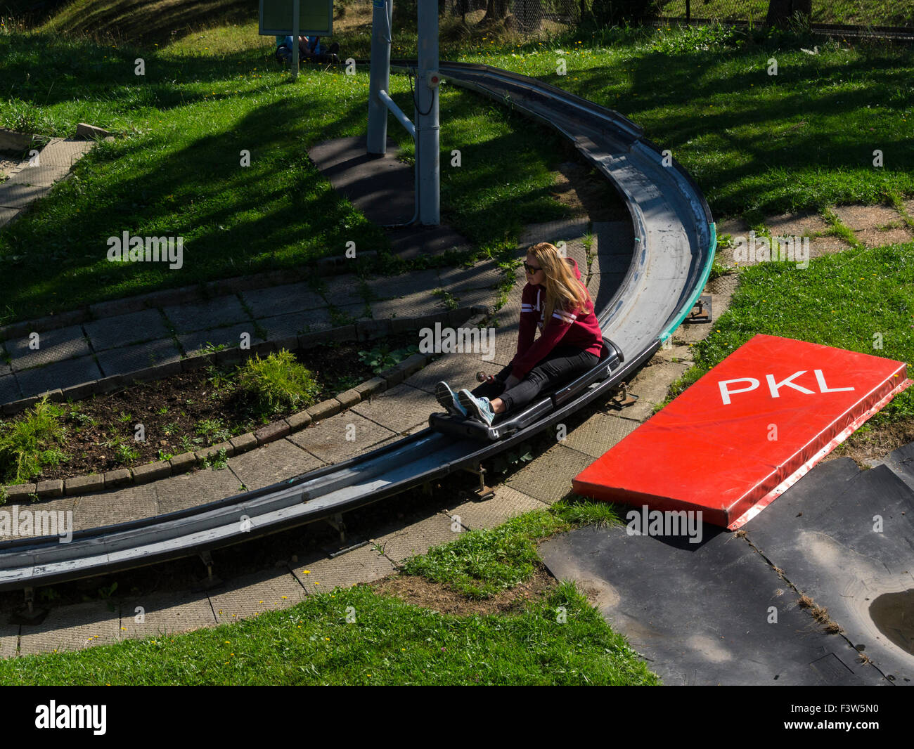 Young girl on gravity dry toboggan on Gubalowka Hill Zakopane Poland