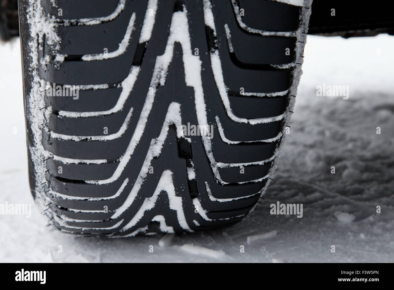 Winter tires with snow Stock Photo