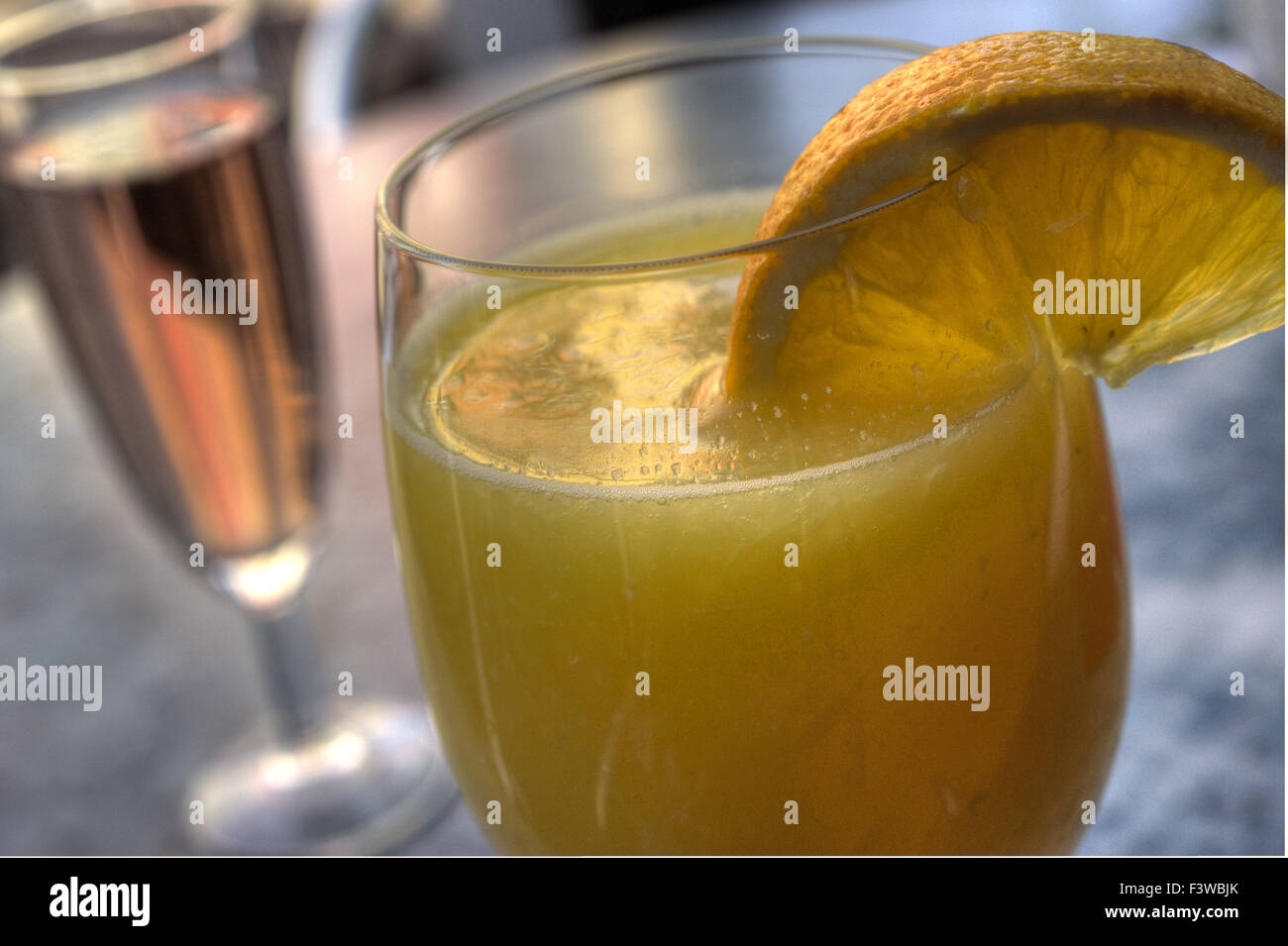 Orange juice and sparkling wine Stock Photo