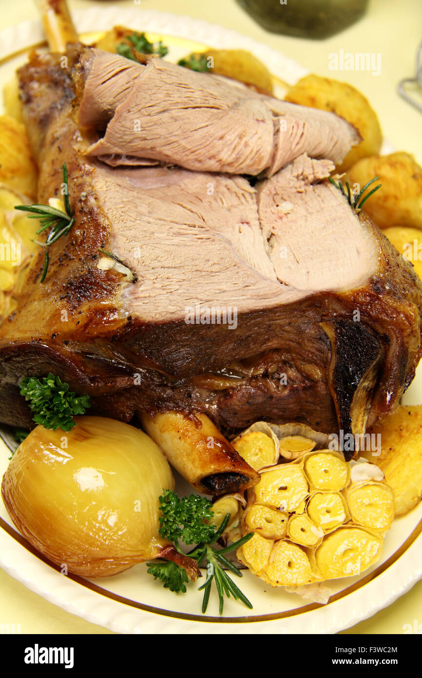 Baked Leg Of Lamb Stock Photo - Alamy