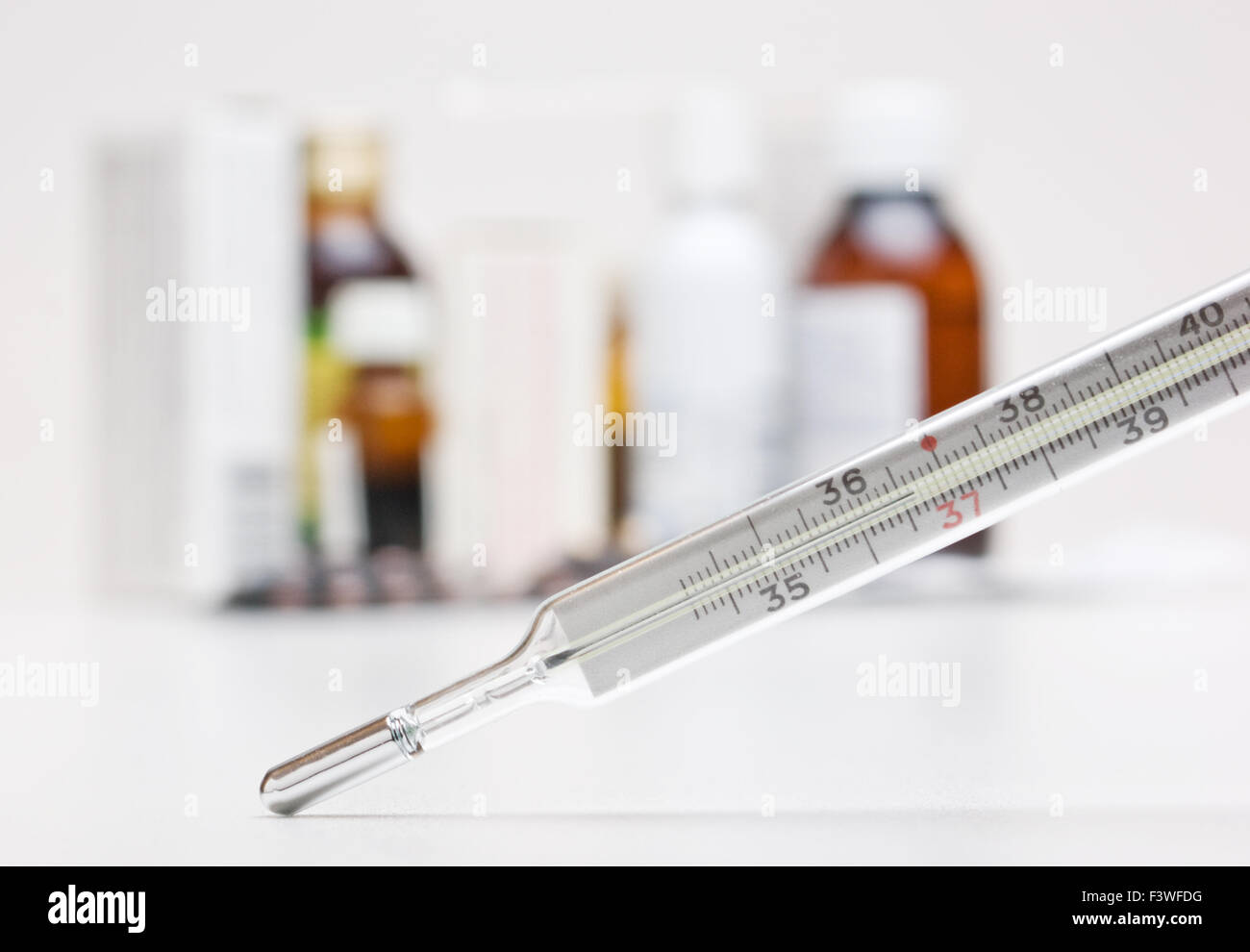 thermometer and group of drugs Stock Photo Alamy
