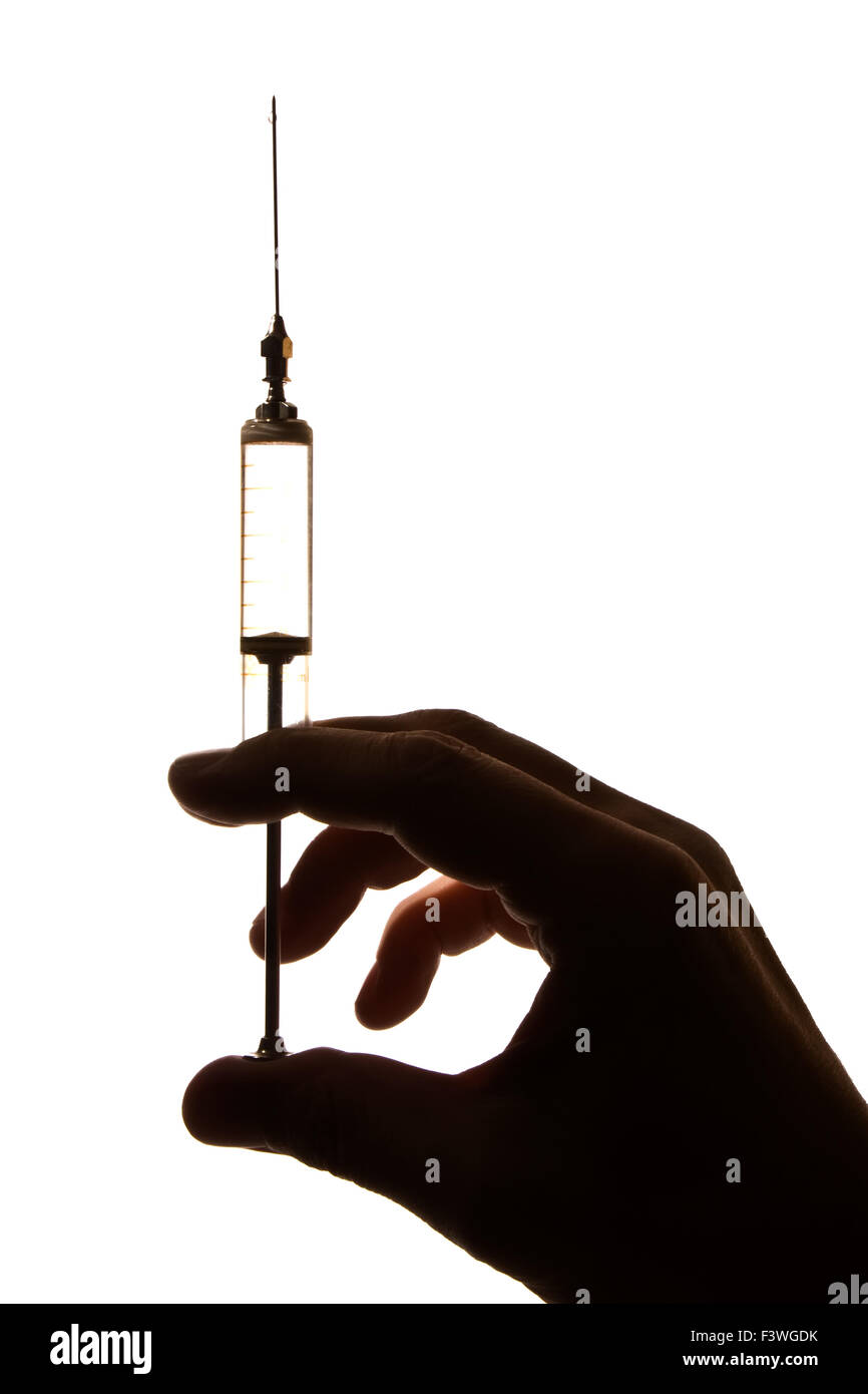 old glass syringe in hand Stock Photo Alamy