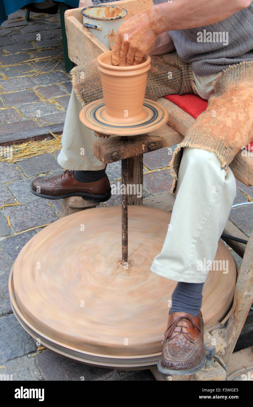 Man making a loam pottery at a market Stock Photo