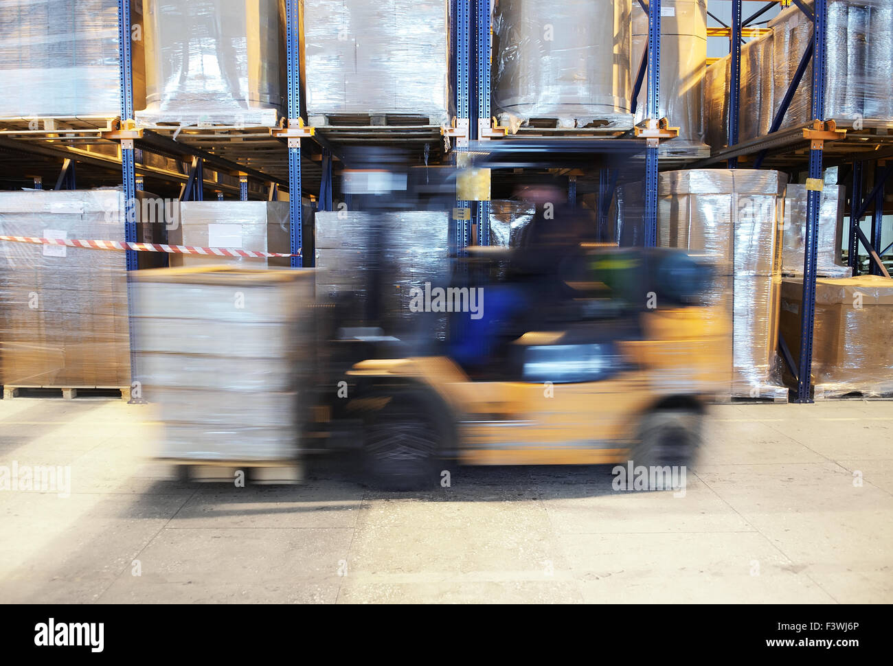 forklift in motion at warehouse Stock Photo