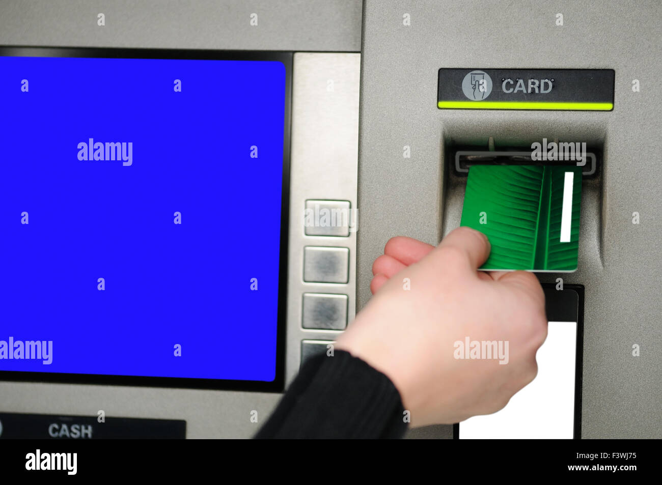 Inserting plastic card visa into ATM Stock Photo