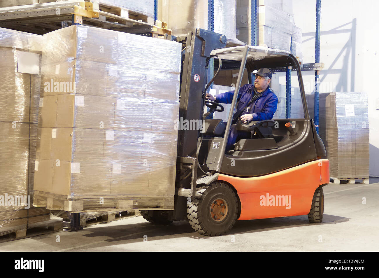 forklift at work with driver Stock Photo