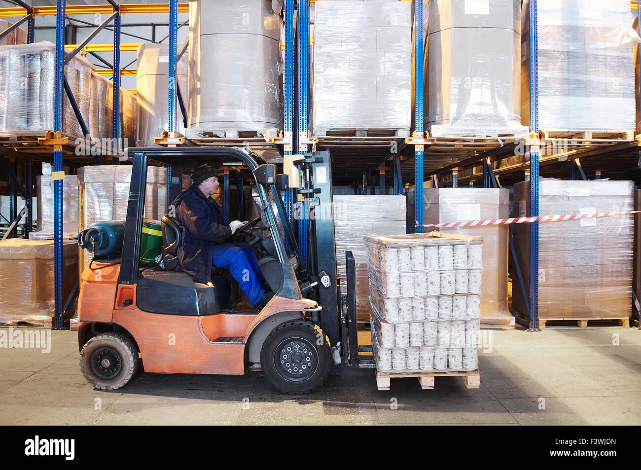 warehouse work with forklift loader Stock Photo Alamy