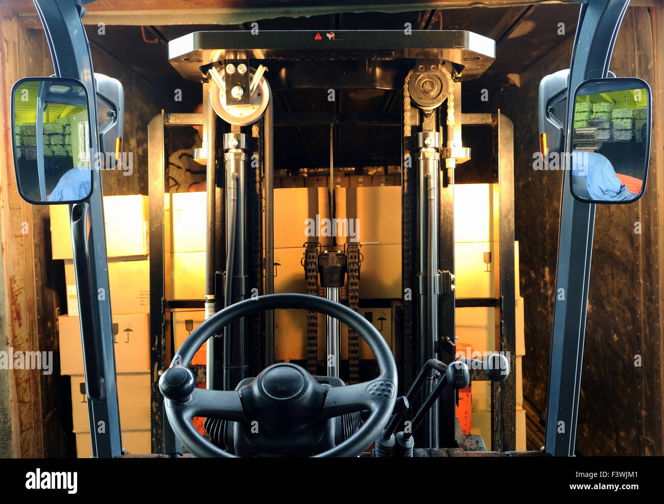 Forklift loading truck Stock Photo - Alamy