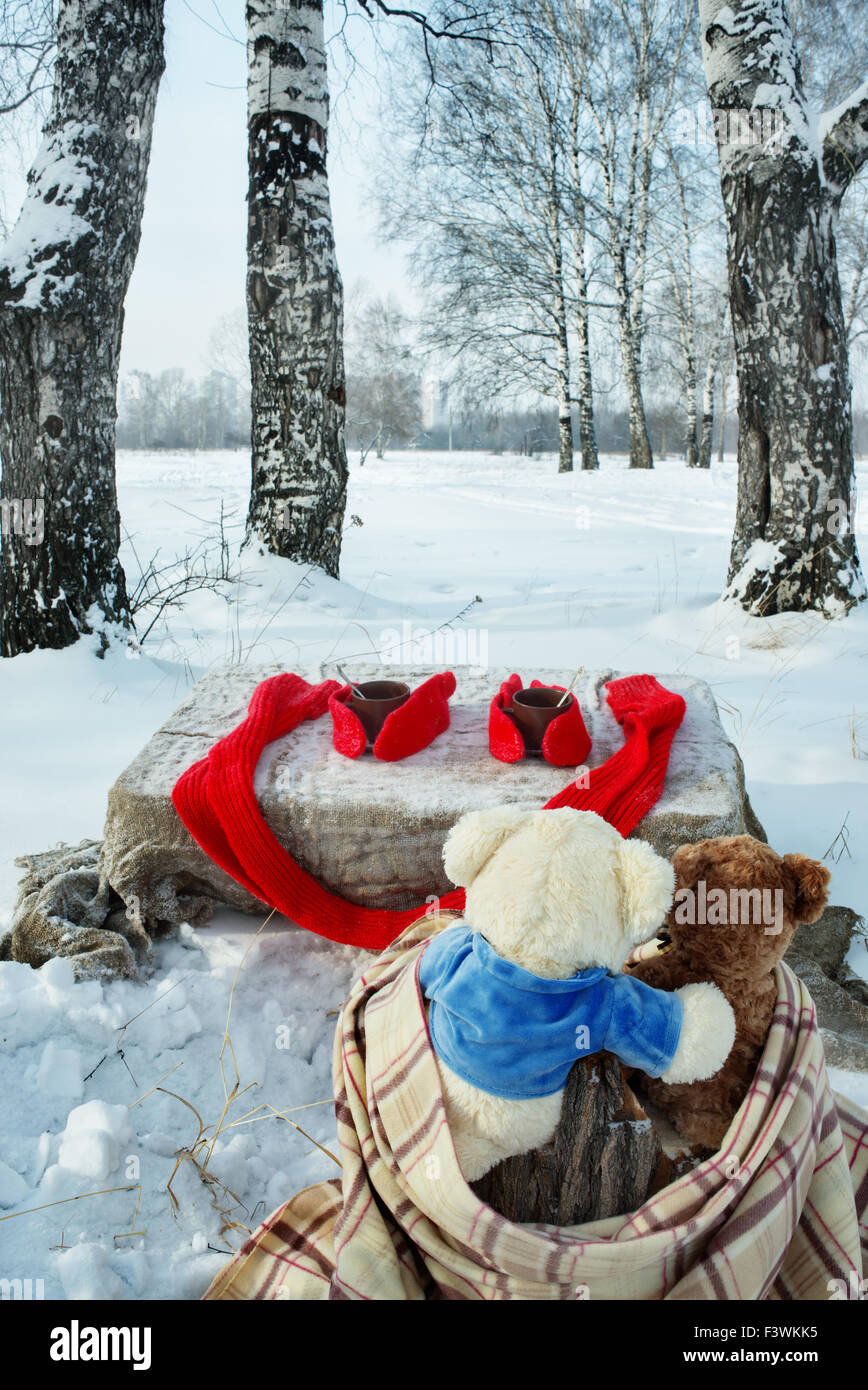 Teddy bears rest in winter forest Stock Photo - Alamy
