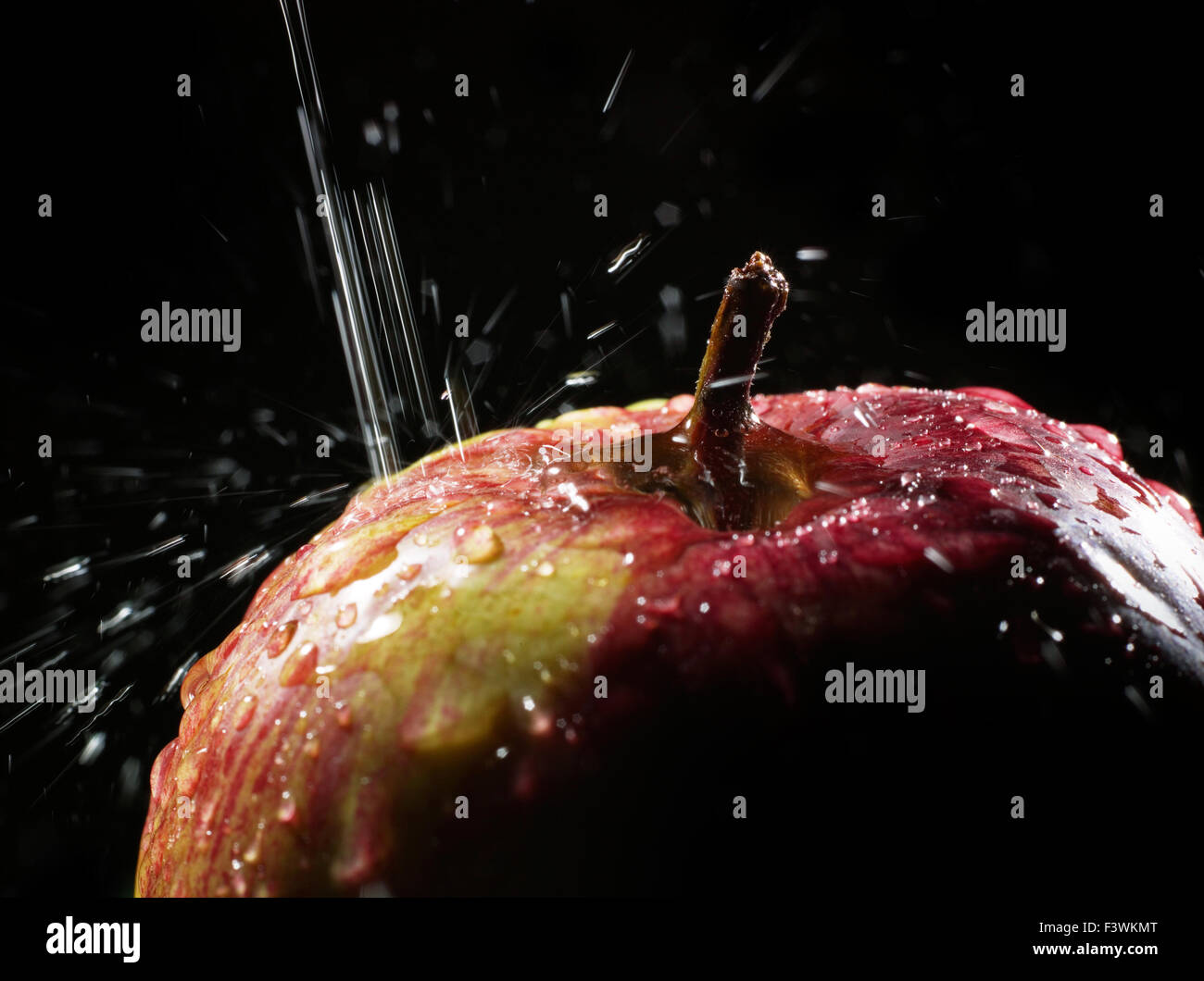 red apple under running water Stock Photo