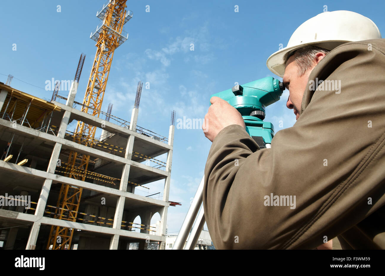 Surveyor with transit level equipment Stock Photo Alamy