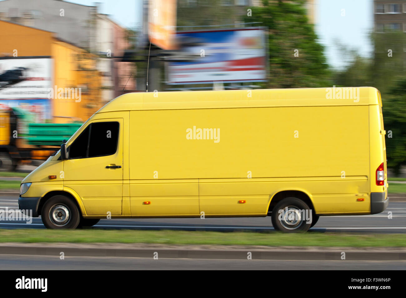 Yellow speeding van with space for text Stock Photo