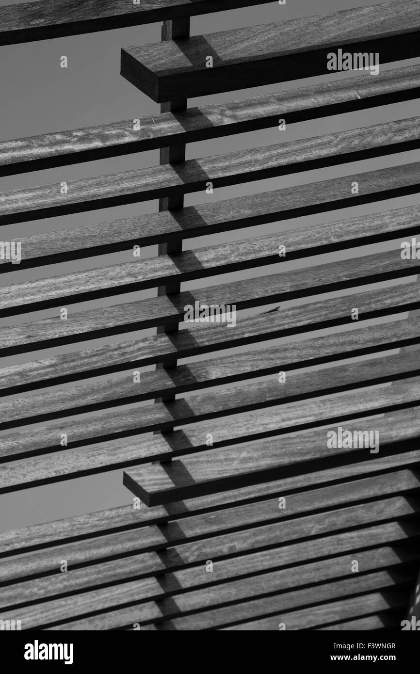 mono wooden struts with a repeating pattern Stock Photo
