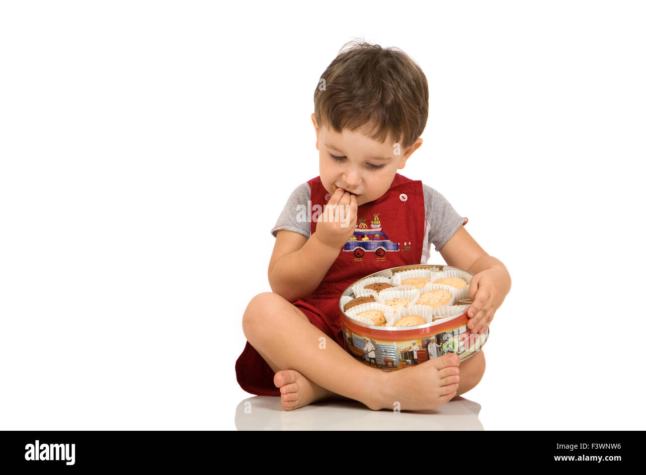Boy tests biscuits Stock Photo
