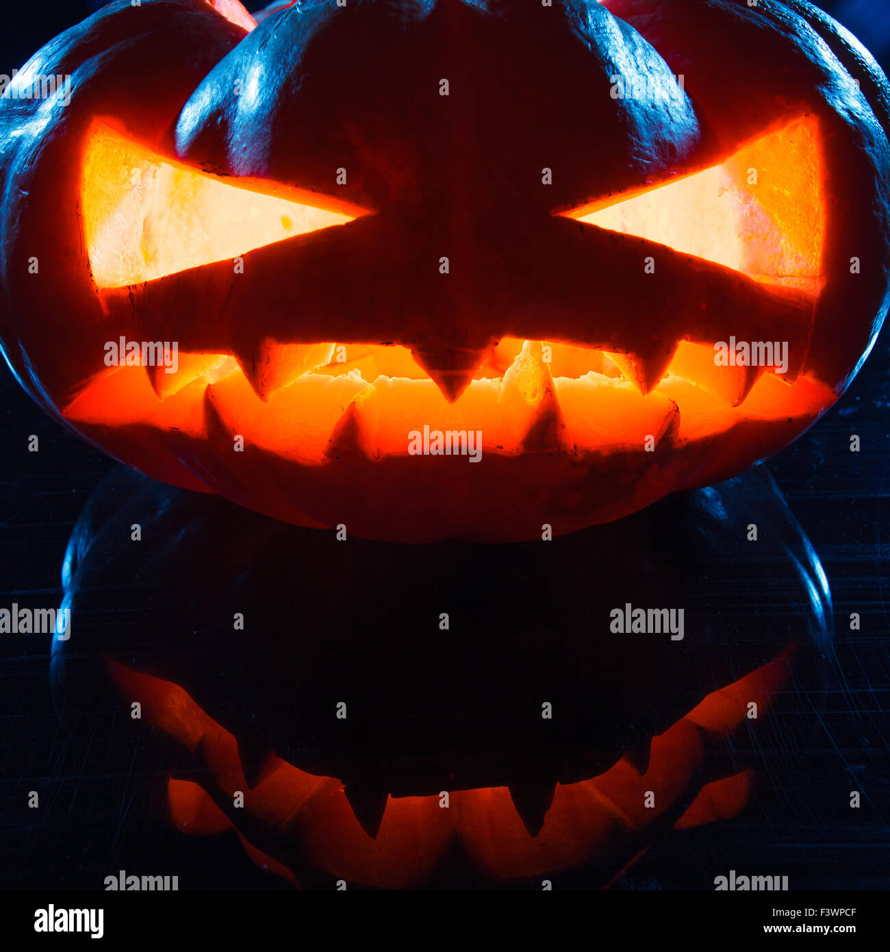 Halloween - terrible pumpkin on black background Stock Photo - Alamy