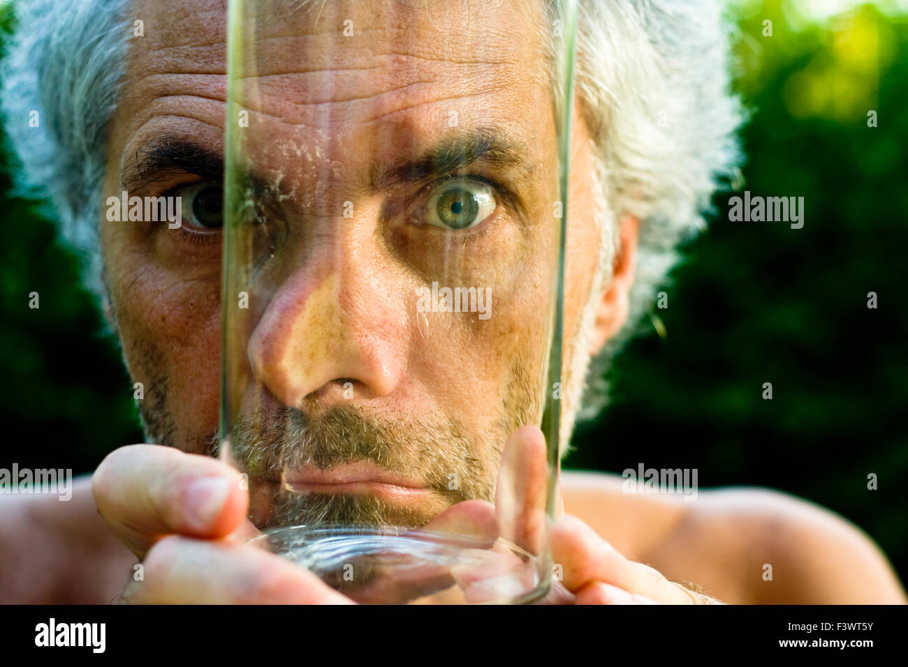 Face behind glass Stock Photo