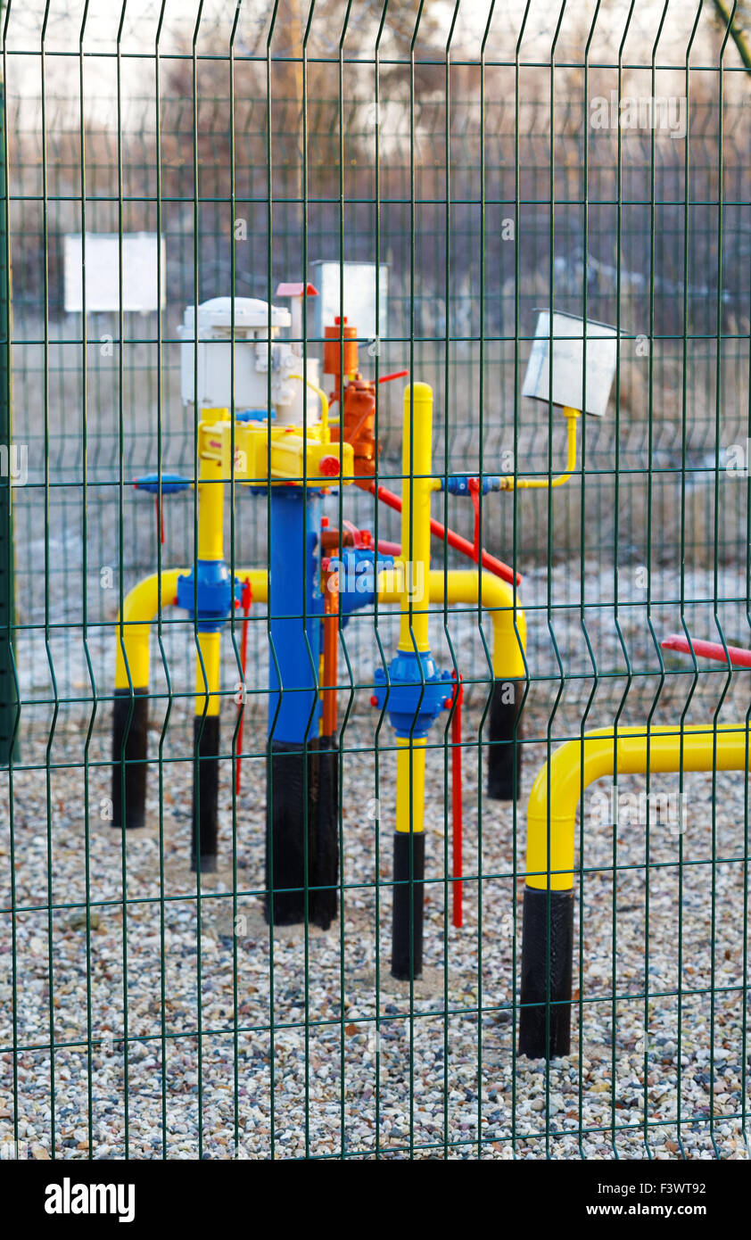 Yellow gas pipe with a crane and valve Stock Photo