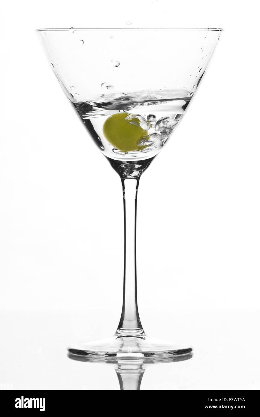 cocktail glass with green olive Stock Photo